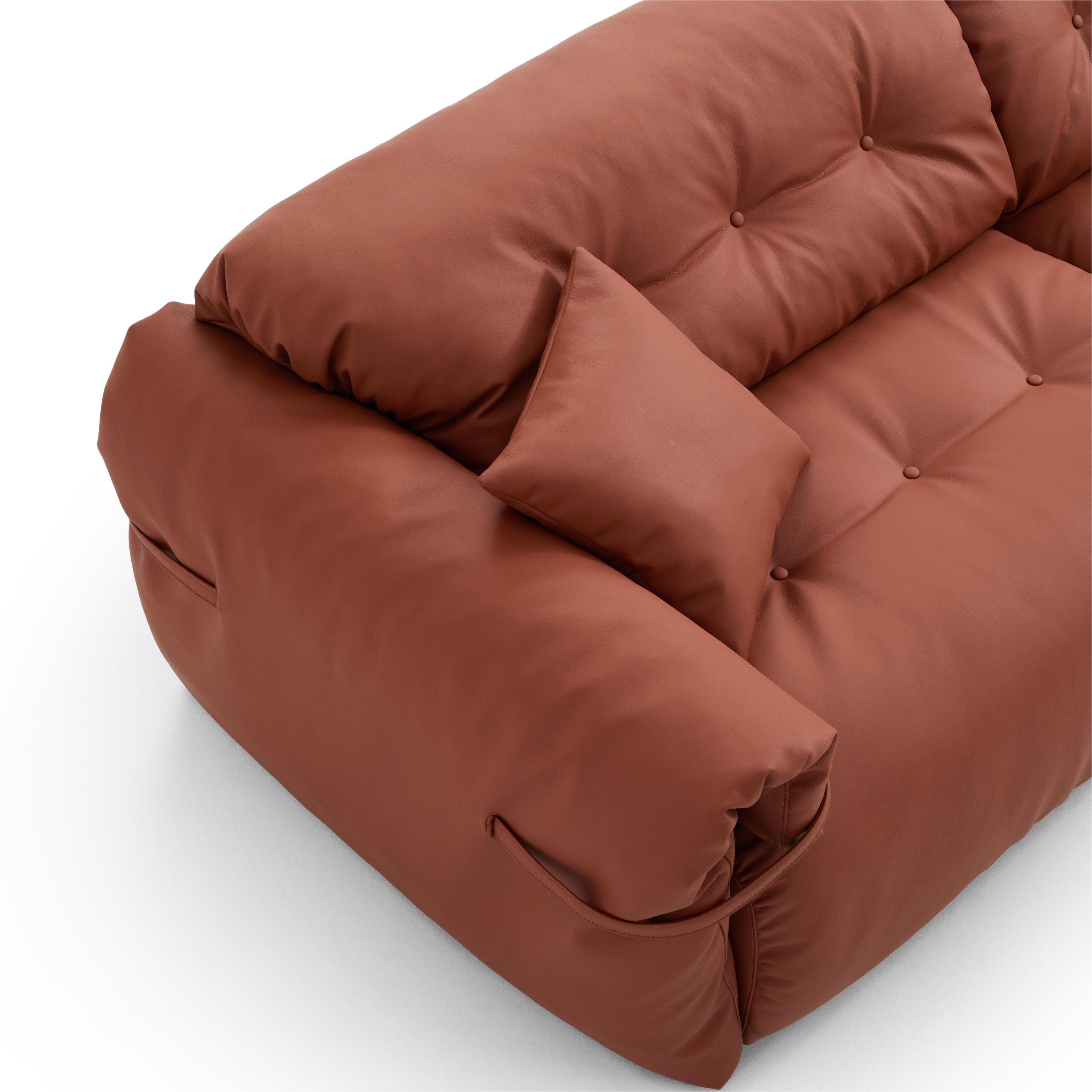 Canapé en cuir véritable brun rougeâtre capitonné beurre