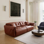 Canapé en cuir véritable brun rougeâtre capitonné beurre