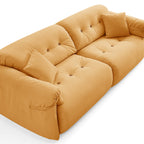 Canapé capitonné couleur beurre