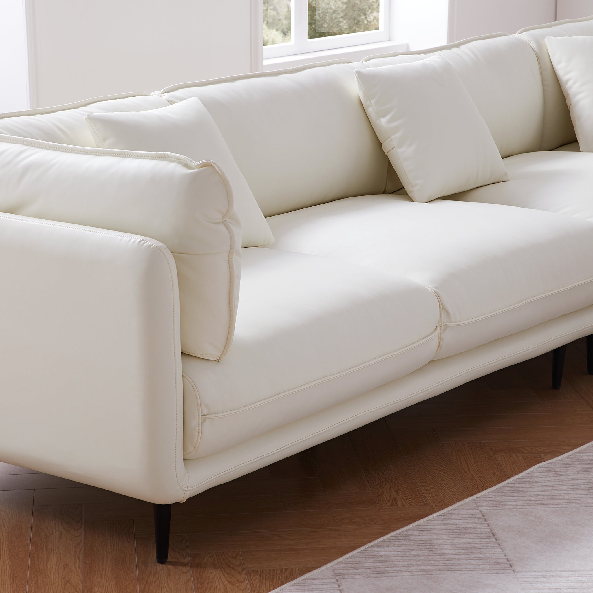 Canapé d'angle en cuir blanc vanille