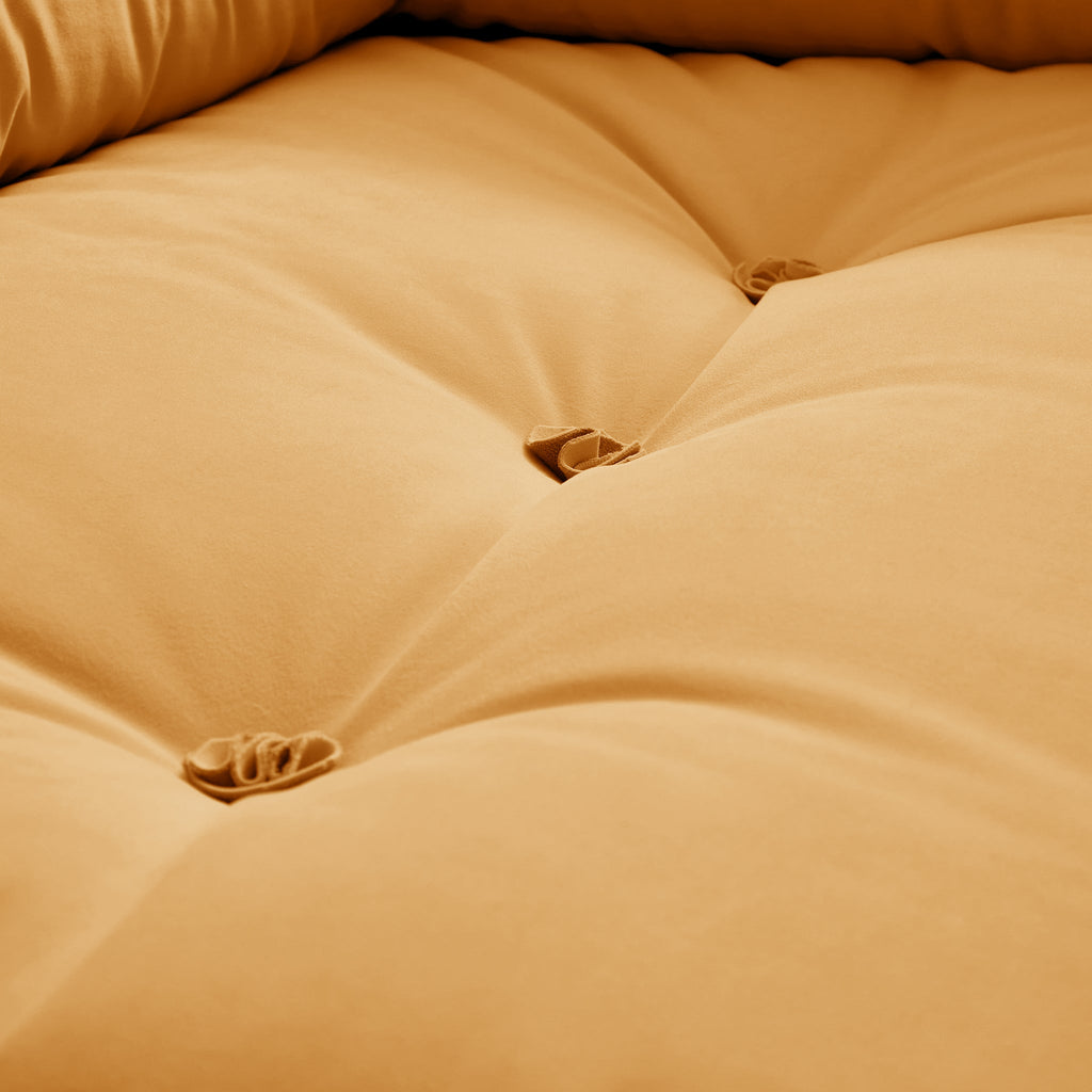 Canapé capitonné jaune beurre