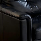 Canapé baroque capitonné en cuir noir 